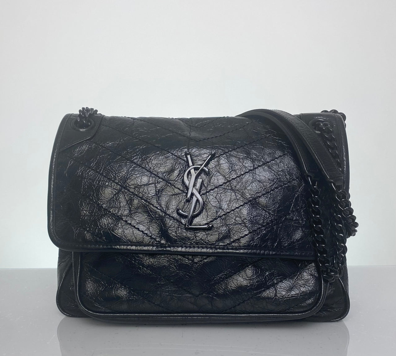 Saint Laurent Niki bag

YSL black crinkled leather bag

Medium Niki Saint Laurent

YSL all black bag

Saint Laurent convertible chain bag

Preloved YSL Niki

YSL black hardware purse

Saint Laurent shoulder bag

Designer black leather bag

Authentic YSL Niki medium